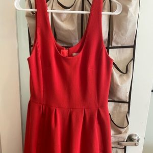 Knee length red dress.